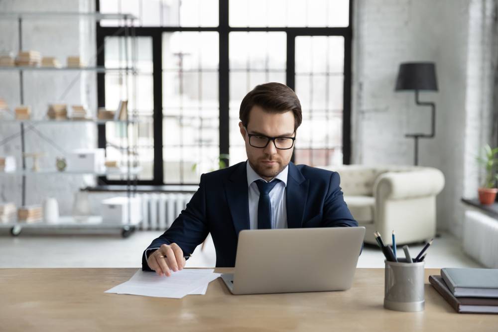 The Filing Process Photo of person at desk