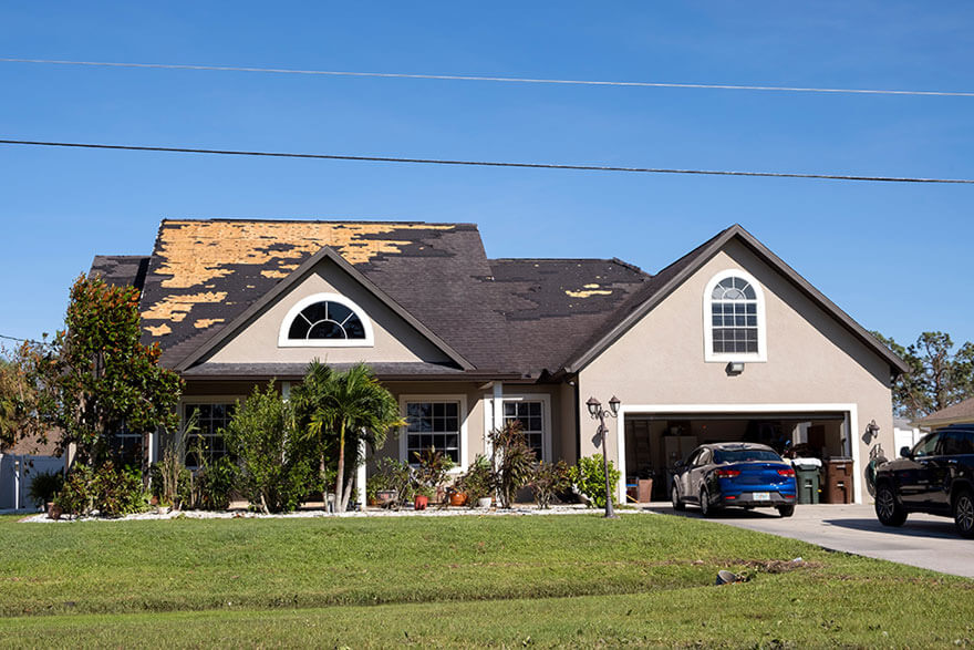 Wind Damage and Insurance Claims Photo of house with damages